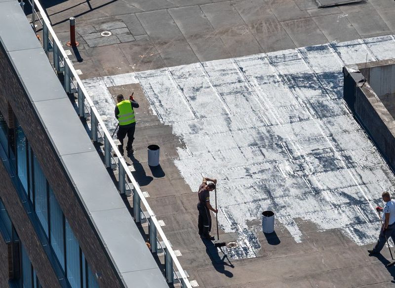 A Group Of People Riding Skis On Top Of A Ramp
