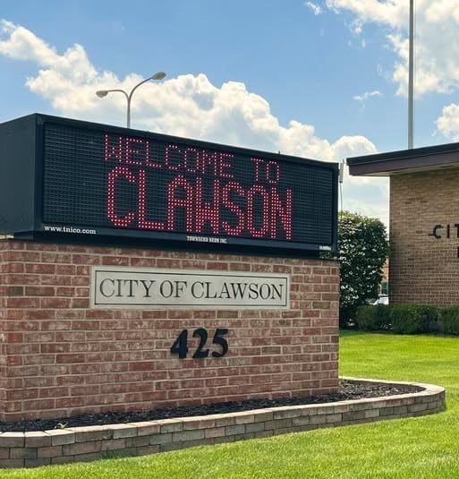 a sign on a brick building