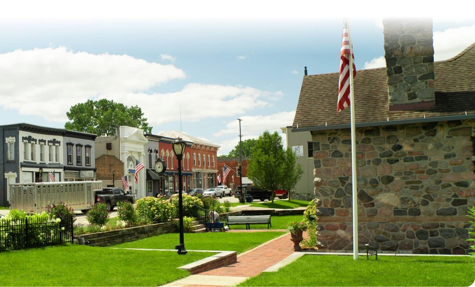 a large brick building with grass in front of a house a large brick building with grass in front of a house