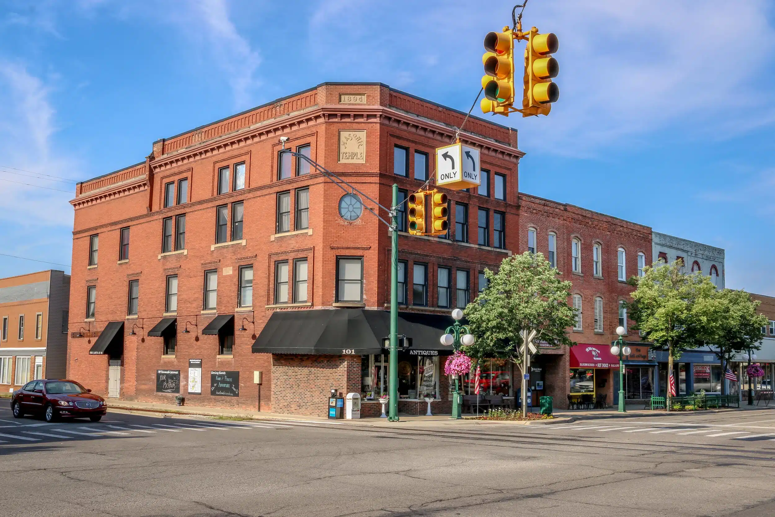 a close up of a street in front of a brick building