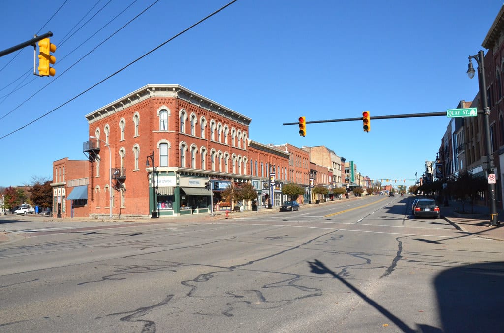 a traffic light hanging over a city street
